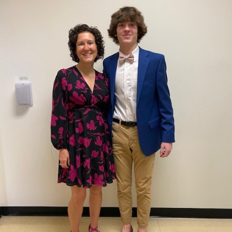 Ms. Helms and a student dressed in professional clothing. 